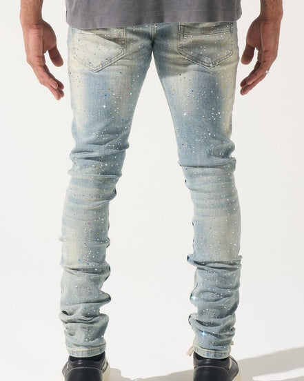 Light blue jeans worn by a person on a white background