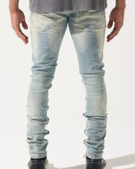 Light blue jeans worn by a person on a white background