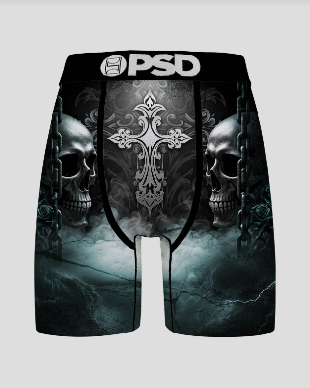 Black briefs with skull and cross design on a gray background