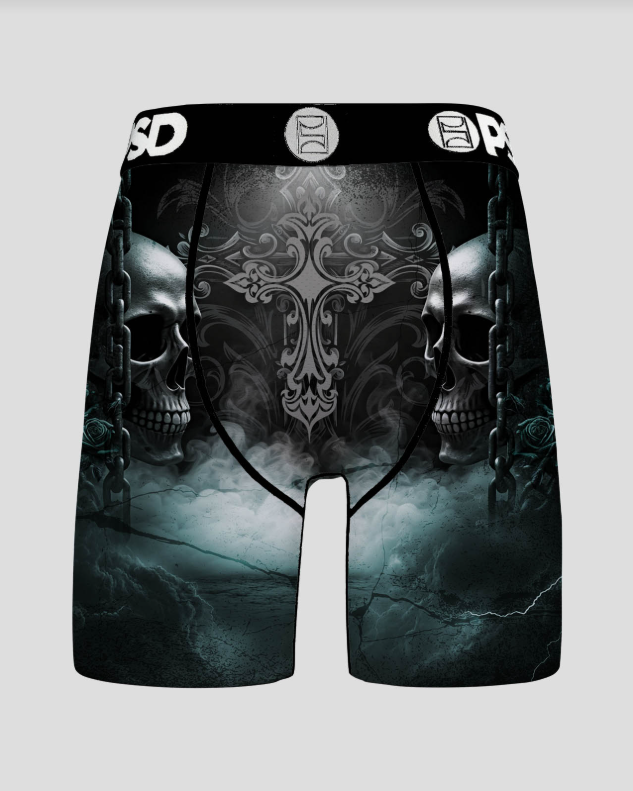 Black athletic briefs with skull and crossbones design on a gray background