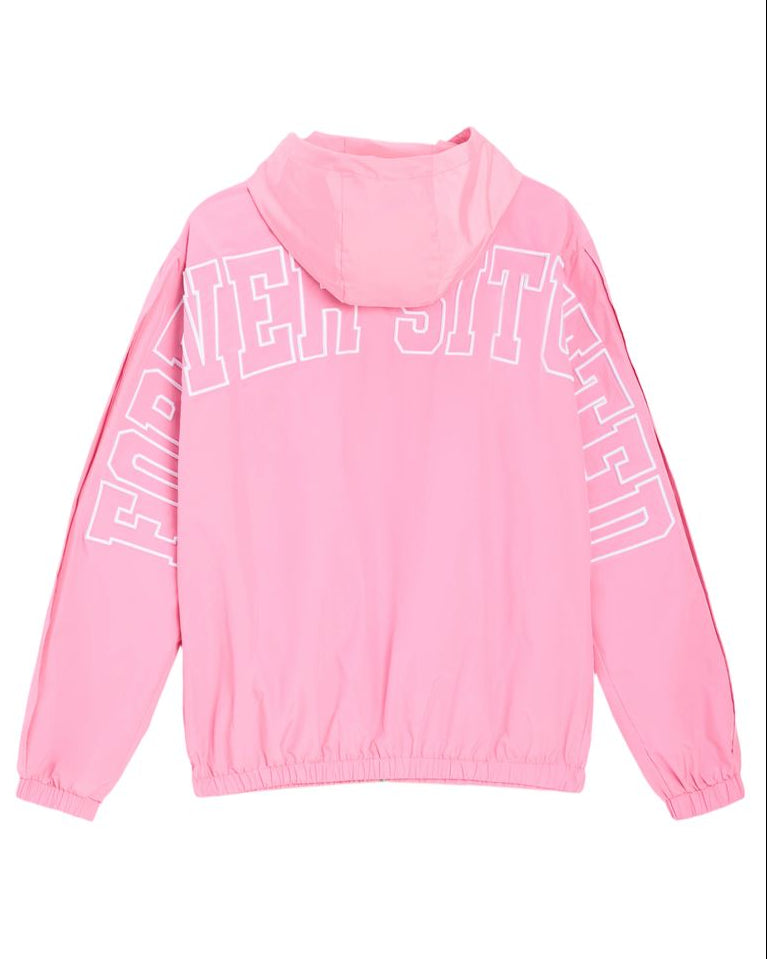 A pink hooded windbreaker jacket shown from the back, featuring large white outline text reading 'FOREVER SITUATED' across the upper back and sleeves, on a plain white background.
