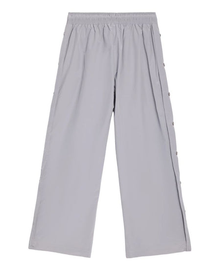 Light gray wide-leg cropped pants with an elastic waistband and decorative side buttons, shown flat on a white background.