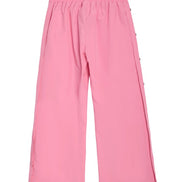 Pink wide-leg cropped pants with an elastic waistband and side buttons, shown flat on a white background.