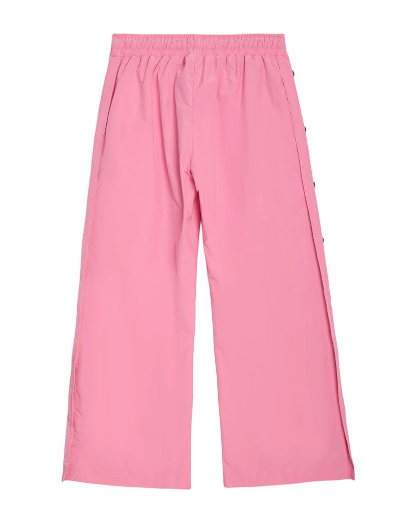 Pink wide-leg cropped pants with an elastic waistband and side buttons, shown flat on a white background.