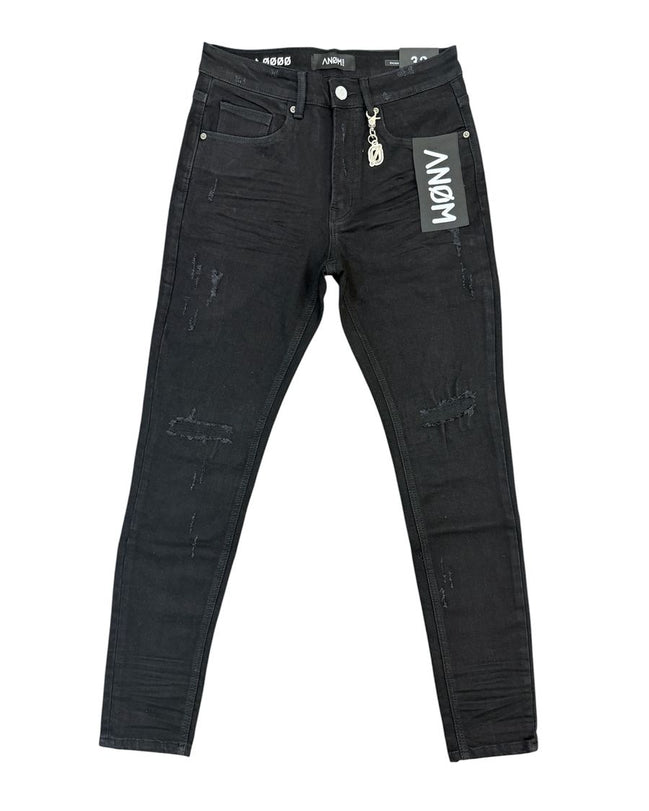 Black distressed skinny jeans with ripped details and a white hangtag on the pocket, displayed flat against a white background.