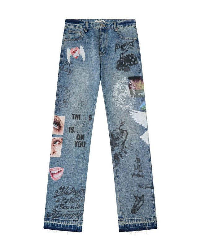Light blue denim jeans with various graphic prints, stickers, and text overlays, shown flat against a white background.