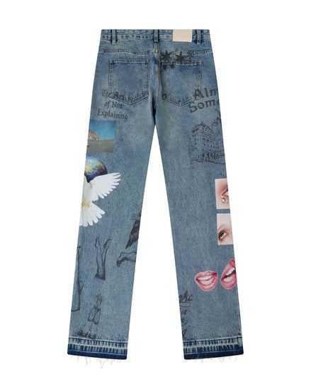 Light blue denim jeans shown from the back, featuring various surreal and graphic prints including a white angel wing, a globe, hand sketches, and pink lips, on a plain white background.