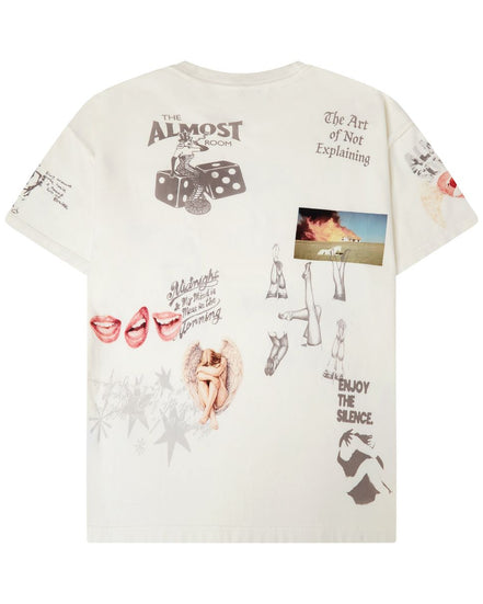 An off-white graphic t-shirt featuring various artistic prints, including dice, lips, sketches, and text like 'The Art of Not Explaining' and 'ENJOY THE SILENCE'.