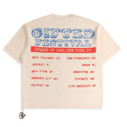 Beige t-shirt with blue and red text on a white background