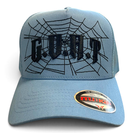 A light blue trucker hat with black embroidered gothic letters spelling 'G.O.