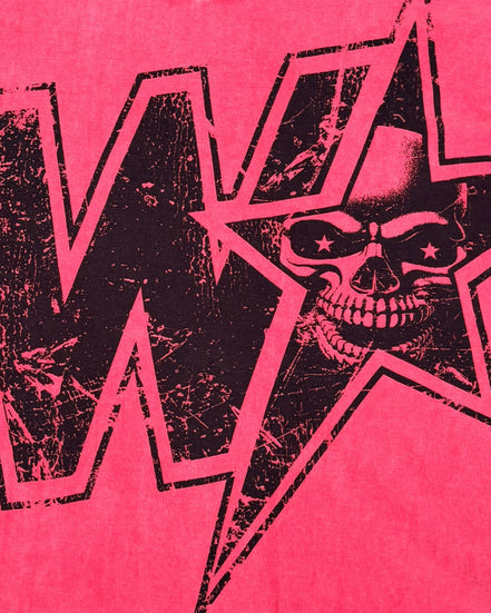 A close-up of a graphic print featuring a black distressed skull inside a star outline, set against a vibrant red wash background with a large black letter 'W' partially visible.
