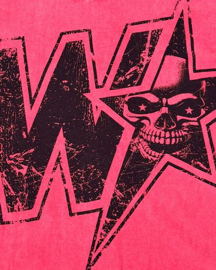 A close-up of a graphic print featuring a black distressed skull inside a star outline, set against a vibrant red wash background with a large black letter 'W' partially visible.