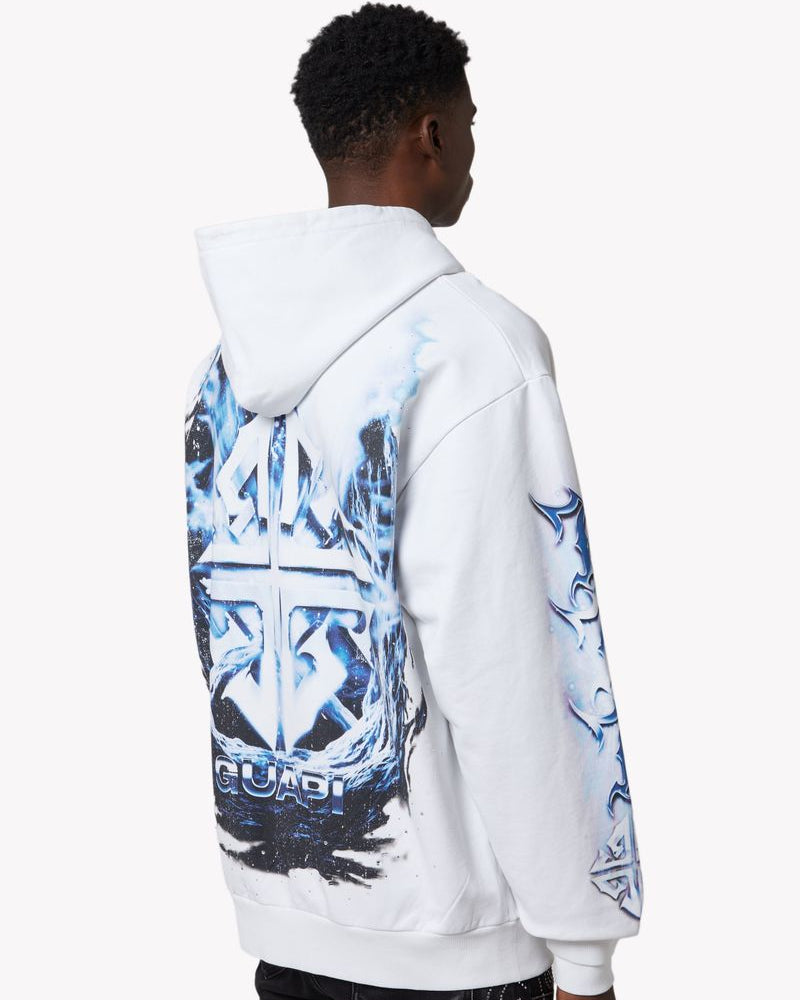 Person wearing a white hoodie with blue and black designs on the back, standing against a white background.