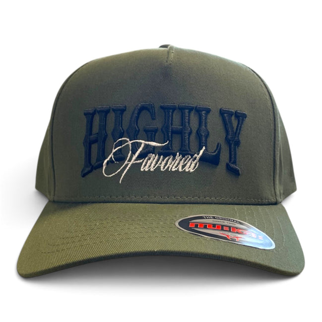 An olive green baseball cap with 'HIGHLY Favored' embroidered on the front in navy and white, featuring a curved brim with a visible Flexfit sticker.
