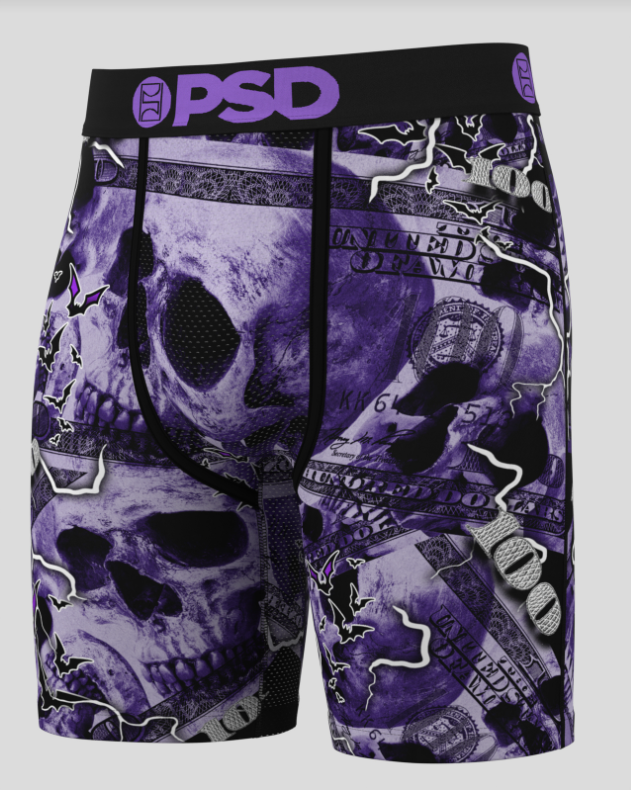 Purple skull and dollar bill patterned shorts with 'PSD' branding on a white background