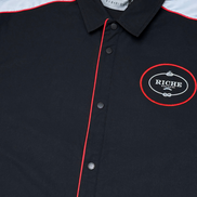 Black jacket with red accents and a logo on a white background