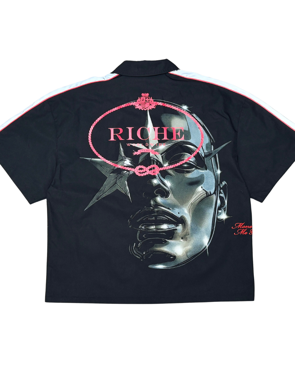 Black shirt with metallic face design and 'RICH' text on a white background