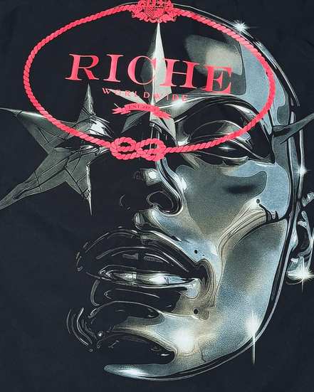 Black t-shirt with a metallic face design and 'Riche' text on a dark background