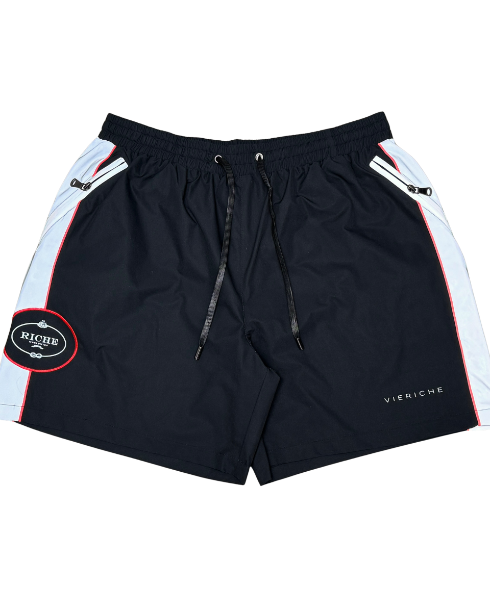 Black shorts with white and red accents on a white background