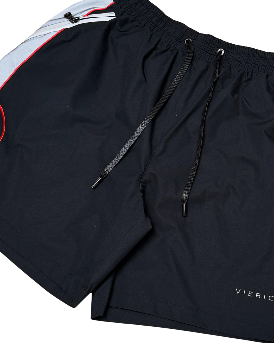 Black shorts with a brand logo on a white background