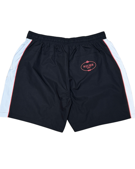 Black shorts with white side panels and a logo on a white background