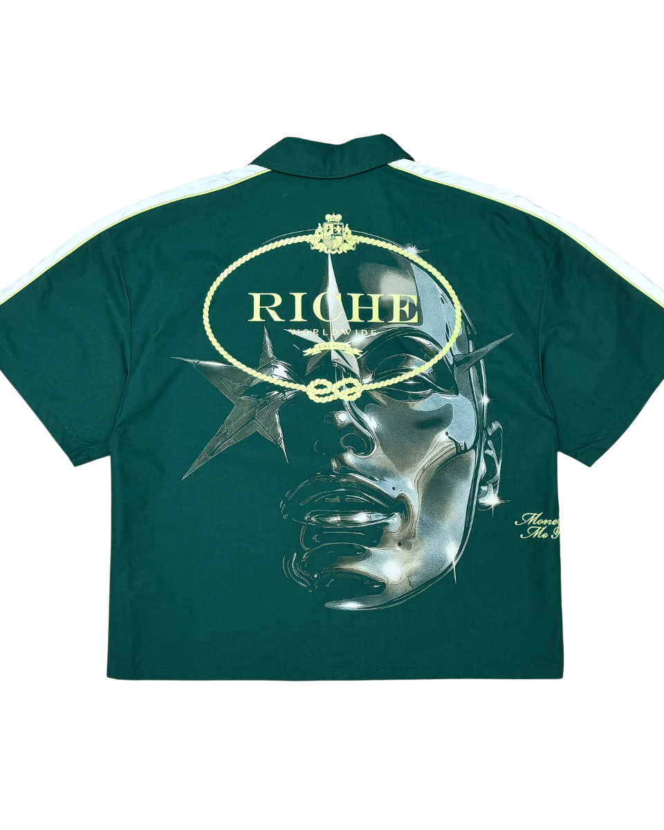 Green shirt with graphic design and 'Riche' branding on a white background
