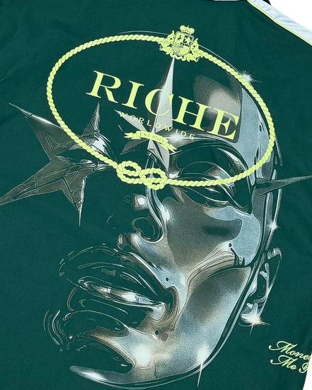 Green t-shirt with a graphic design and 'Riche' branding on a white background