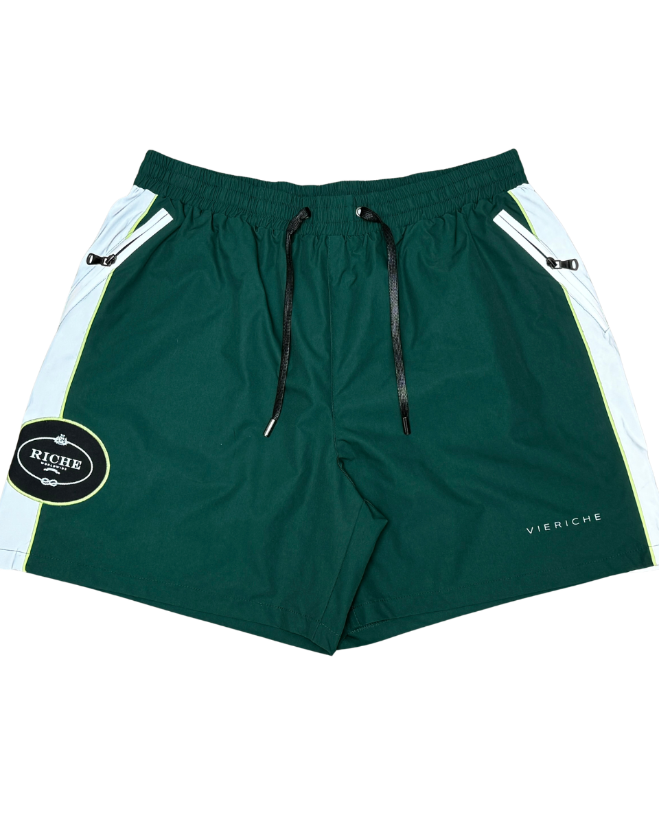Green shorts with white accents and a visible brand logo on a white background