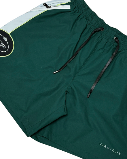 Green shorts with a brand logo on a white background