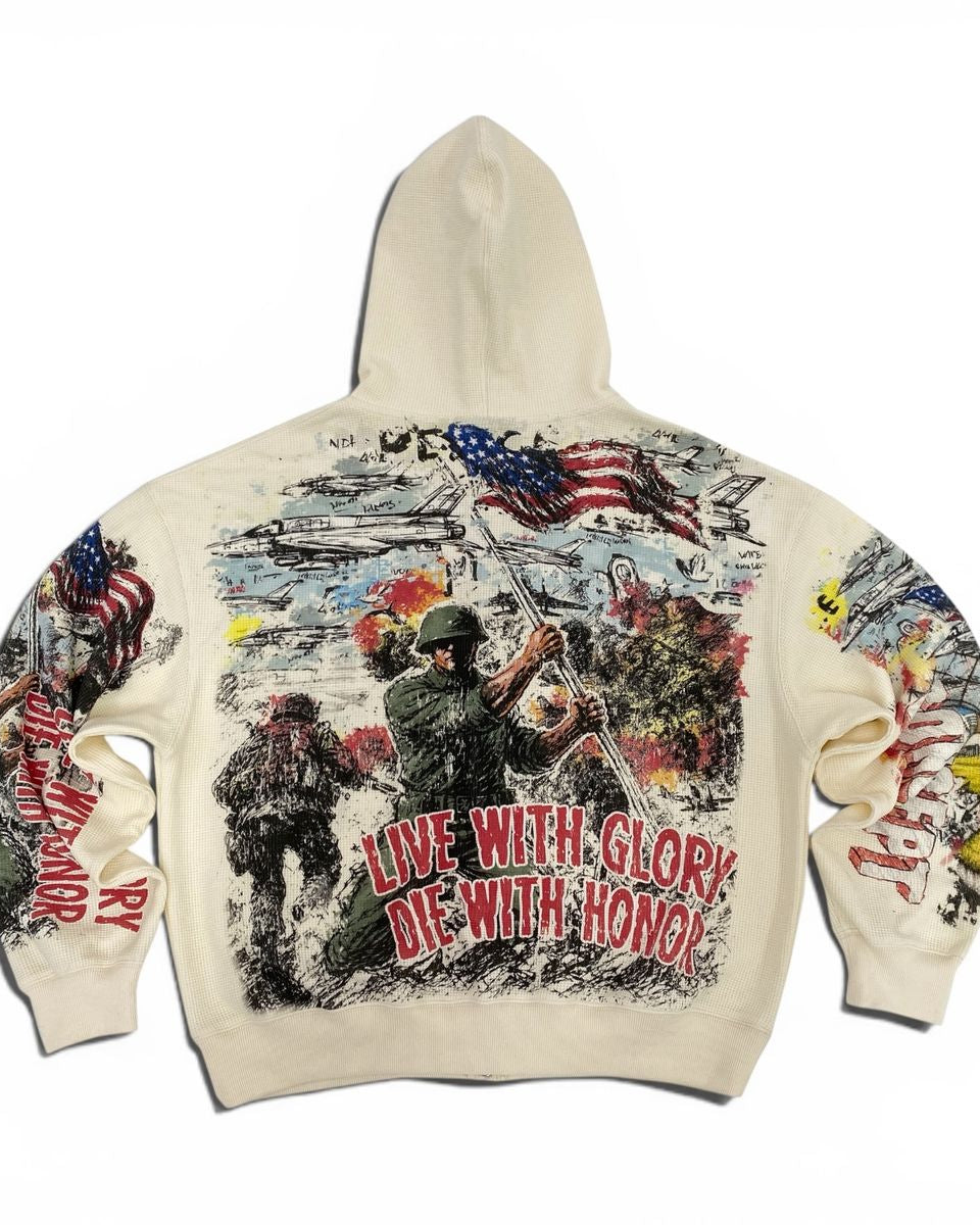 An off-white hooded sweatshirt shown from the back, featuring a large, detailed graphic print with soldiers, American flags, helicopters, and the text 'LIVE WITH GLORY DIE WITH HONOR' on the back, and additional graphics on both sleeves.