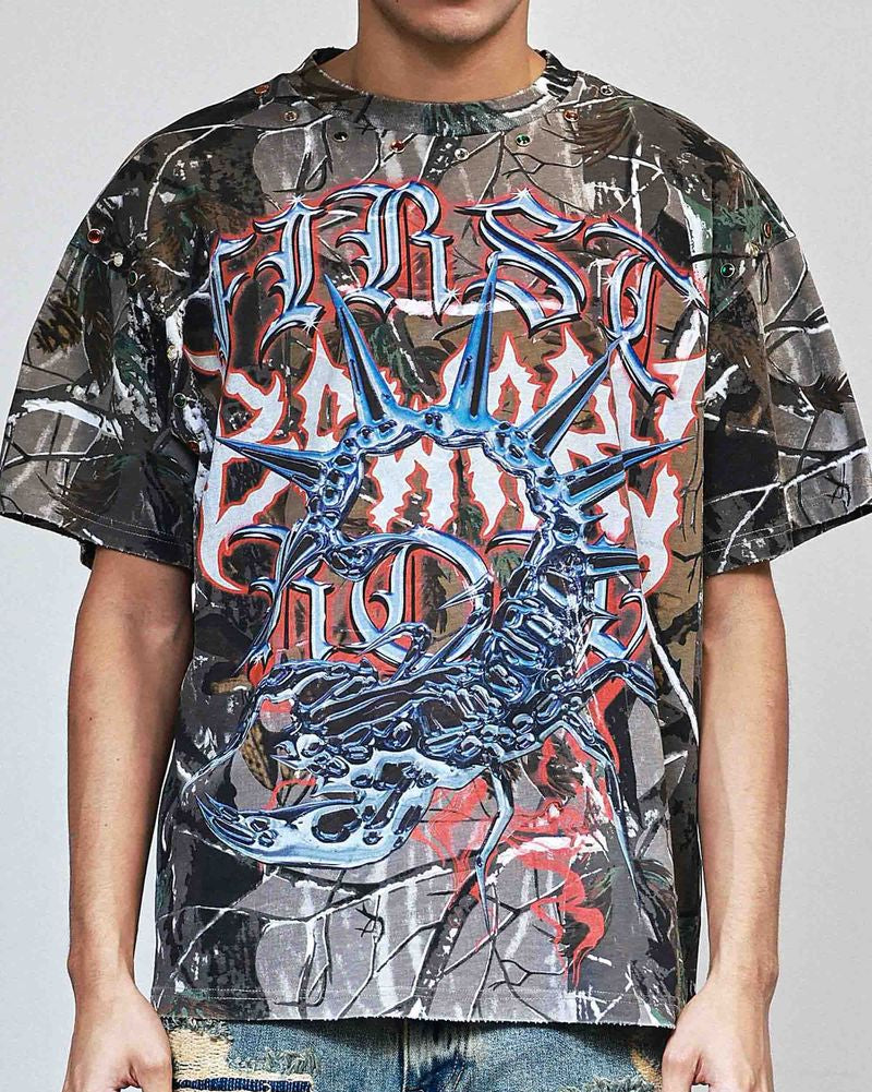 Person wearing a graphic t-shirt with a prominent design on a plain background