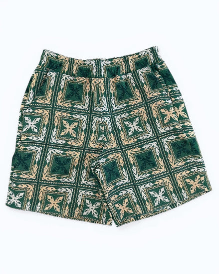 Green patterned shorts on a white background