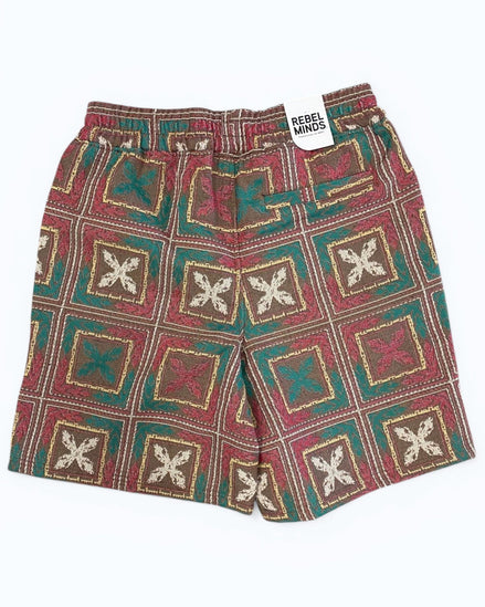 Patterned shorts with a visible brand tag on a white background