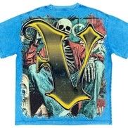 Blue t-shirt with a skeleton design and large yellow letter 'V' on a white background