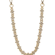 Gold chain with floral designs on a white background