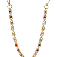 Pant chain with multicolored gemstones on a white background