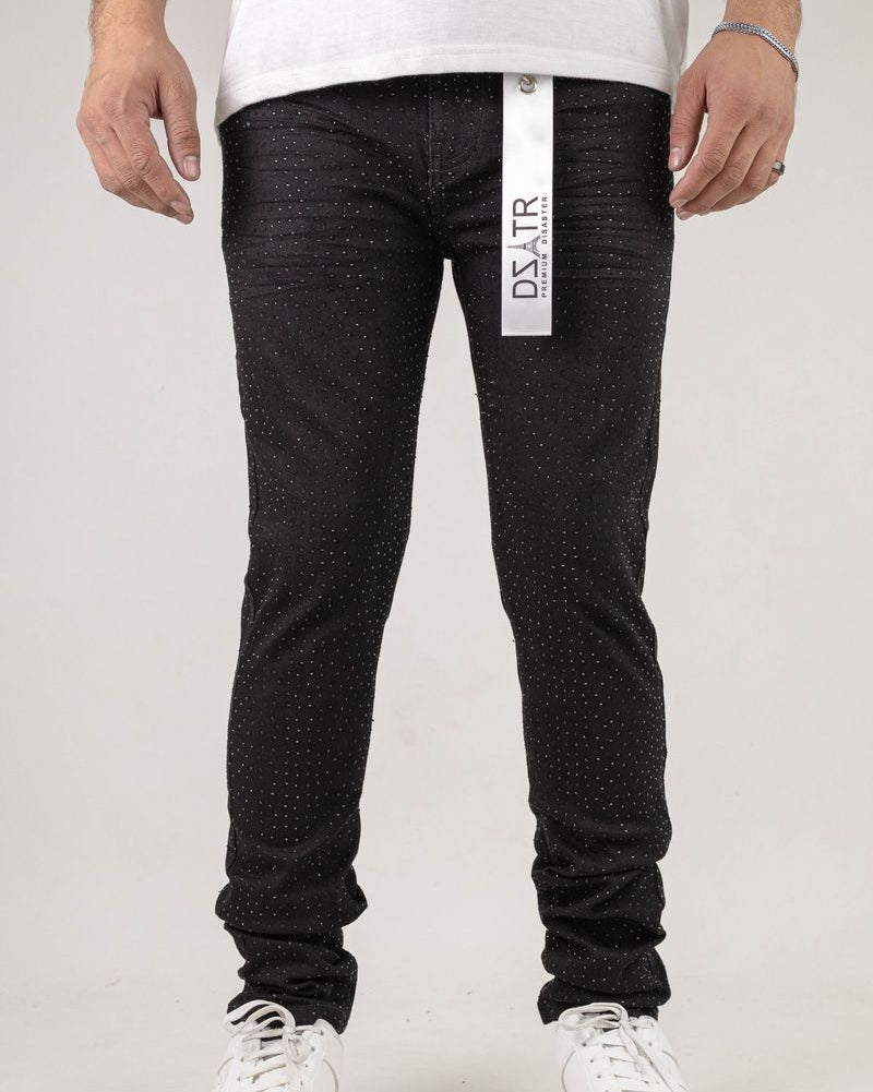 Person wearing black pants with a visible brand label on a white background