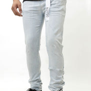 Person wearing light ice blue with a brand label on a white background