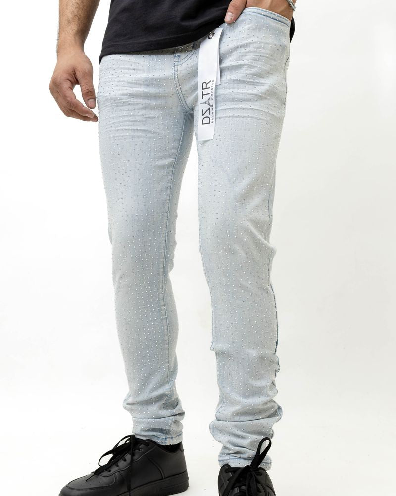 Person wearing light ice blue with a brand label on a white background