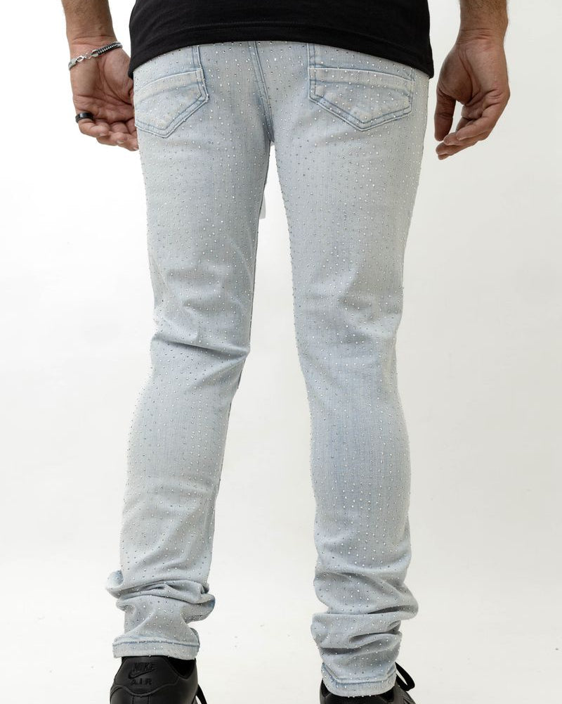 Light blue jeans worn by a person on a white background