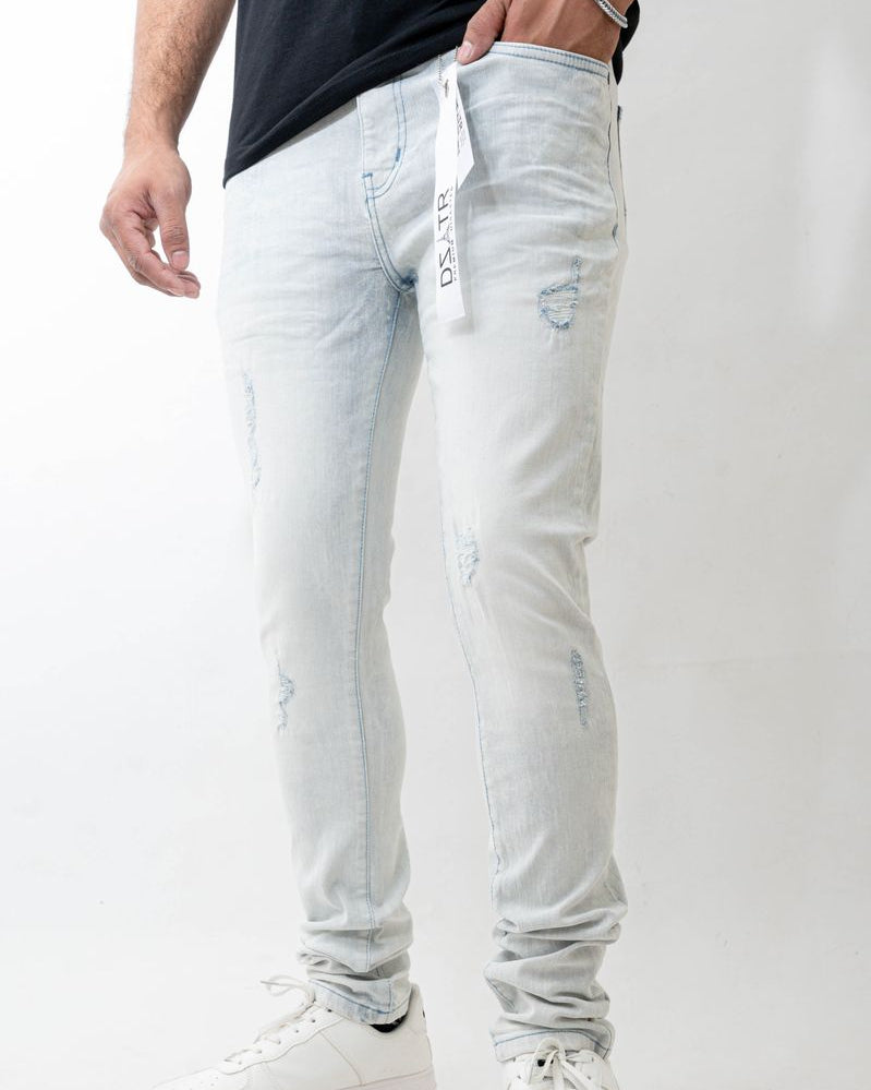 Light blue jeans worn by a person on a white background
