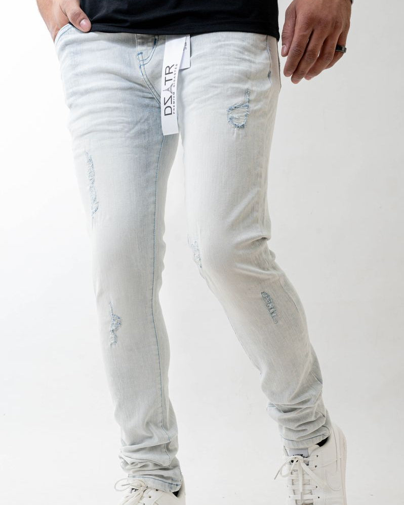 Light blue distressed jeans with a brand tag on a white background