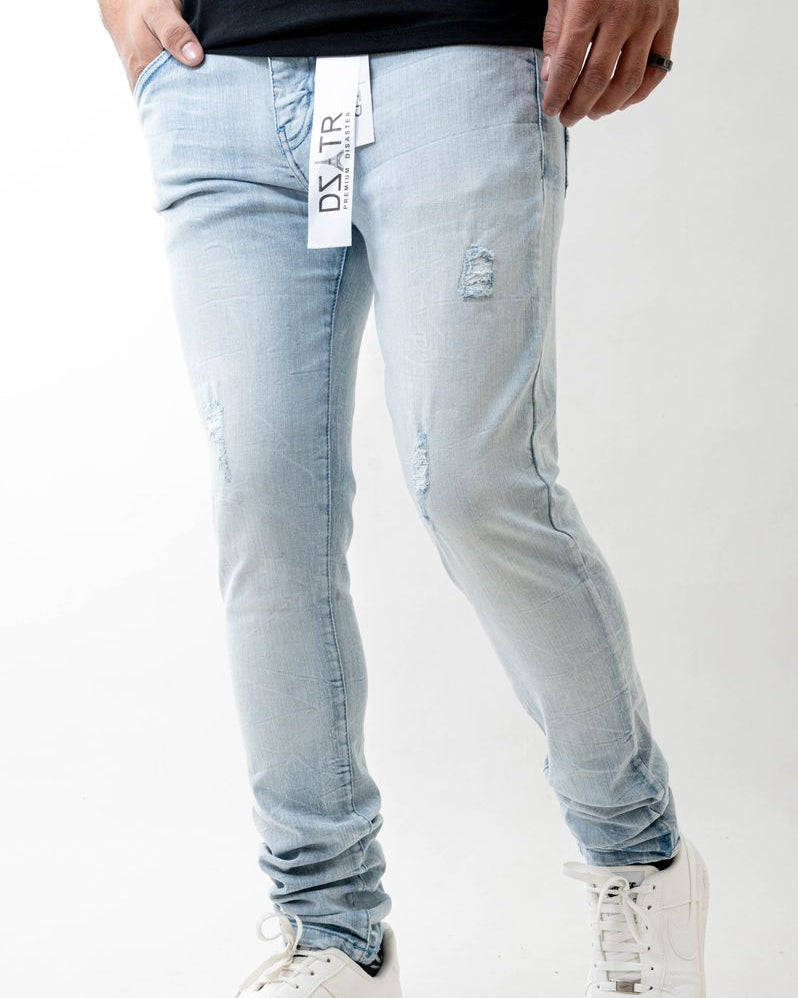 Light blue jeans worn by a person on a white background