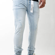 Light blue jeans with a brand label on a white background