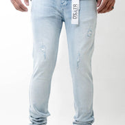 Light blue jeans with a brand label on a white background