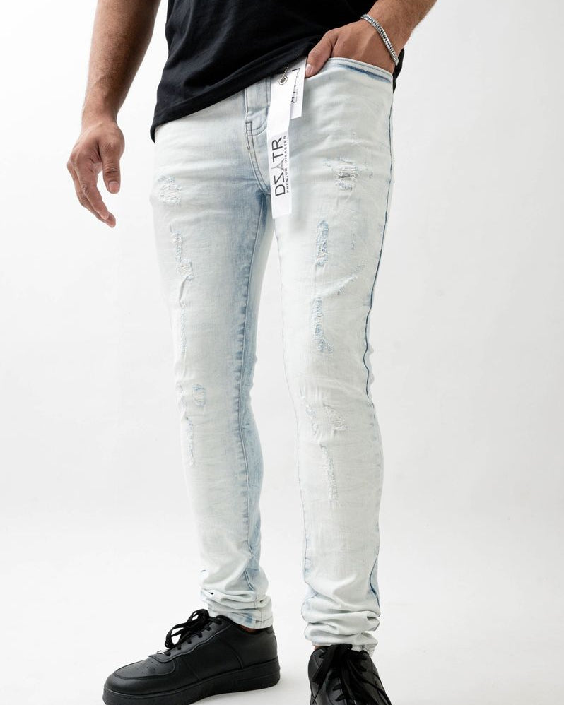 Person wearing light blue jeans with a brand logo on a white background