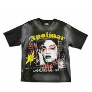 A black short-sleeve graphic t-shirt featuring a distressed, grunge-style print of a face with red glasses and yellow, white, and red text elements.