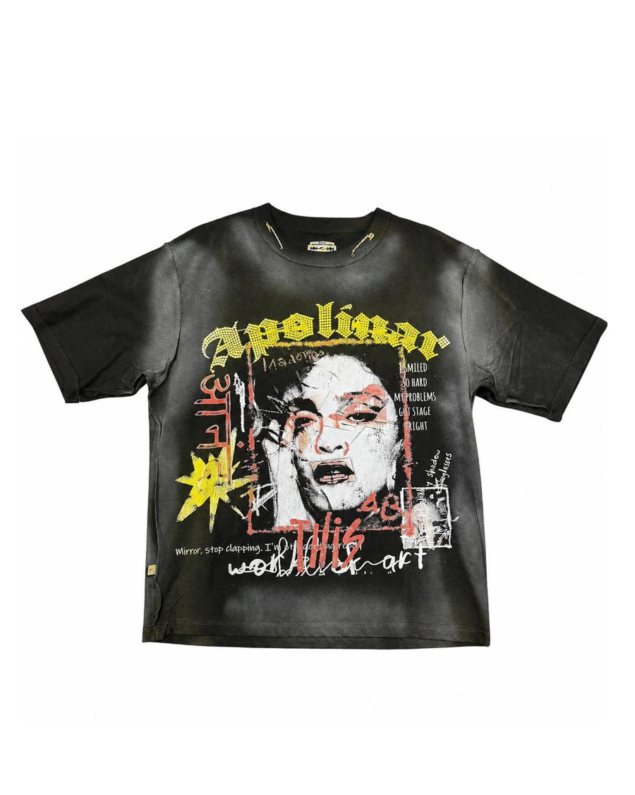 A black short-sleeve graphic t-shirt featuring a distressed, grunge-style print of a face with red glasses and yellow, white, and red text elements.