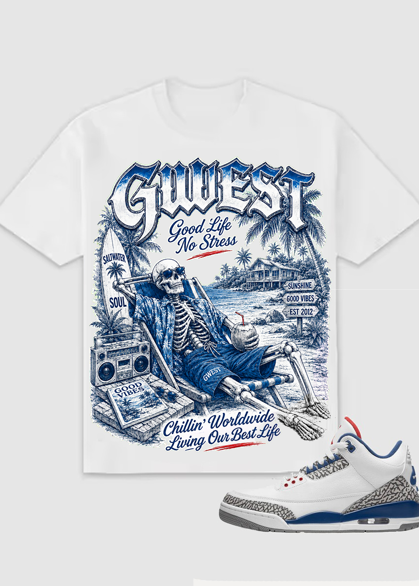 A white short-sleeve graphic T-shirt with a large blue and gray skeleton beach scene print, shown alongside a white sneaker with blue and gray detailing on a light gray background.