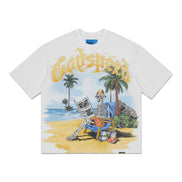 A white short-sleeve t-shirt featuring a colorful graphic print of a skeleton sitting on a beach chair on a tropical beach, with the word 'Godspeed' written in a yellow gothic font above it.